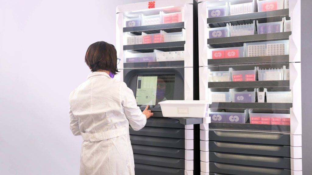 Pneumatic Tube System in Hospitals, Built for Speed to Aid Nursing Staff Hospital staff member using a pneumatic tube system to transport medical supplies quickly and efficiently.